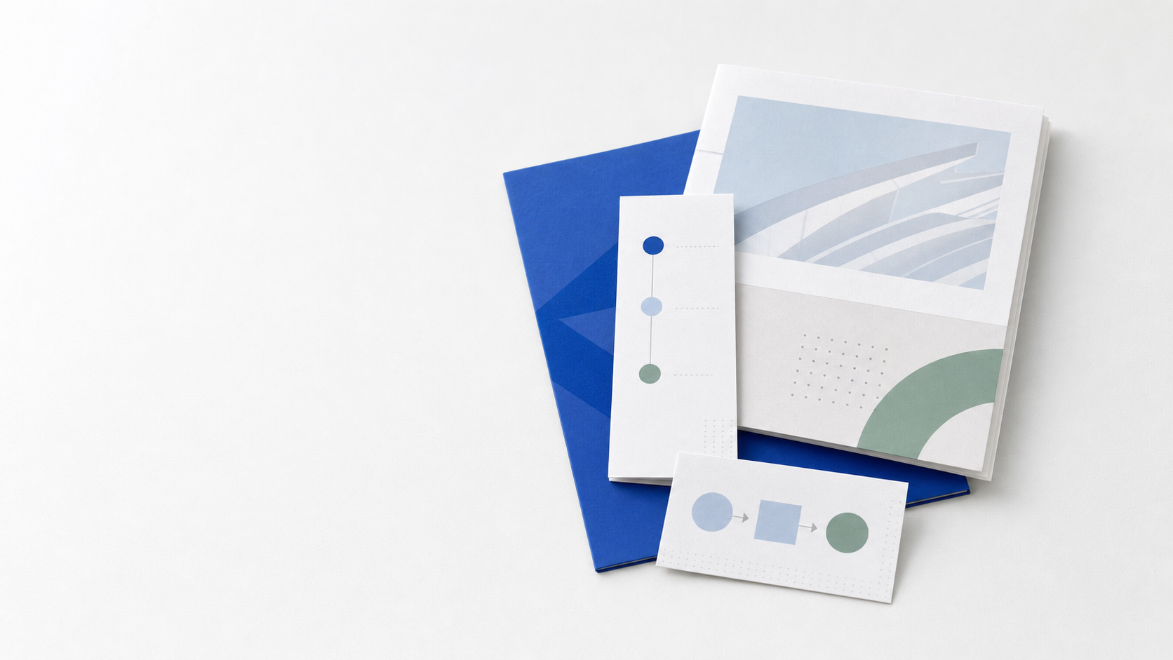 A small stack of clean mockup cards representing a finished content package, arranged on a soft frost-white surface